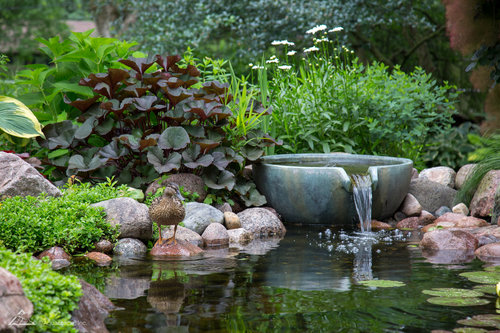 Pond with water feature pouring portland oregon